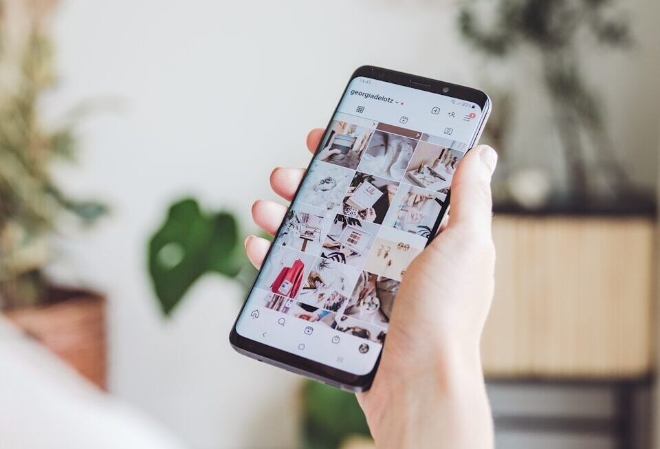 person holding white android smartphone